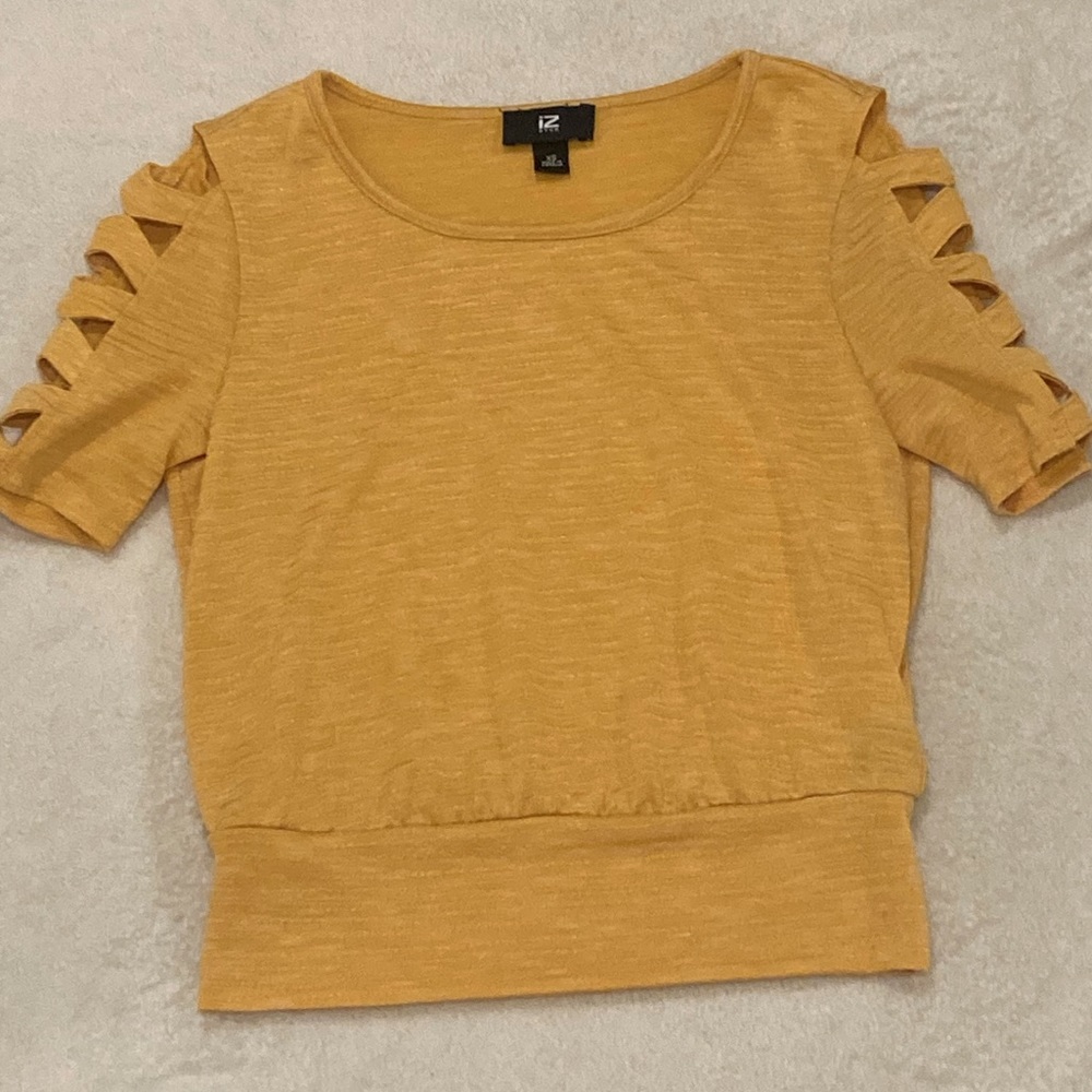 This is a size XS yellow shirt it is from the brand IZbyer